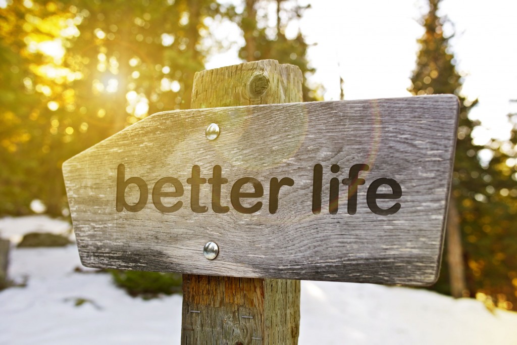 a wooden sign with the words Better Life written on it.