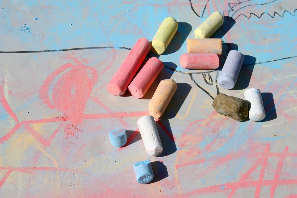 Children's chalk pieces laying on floor