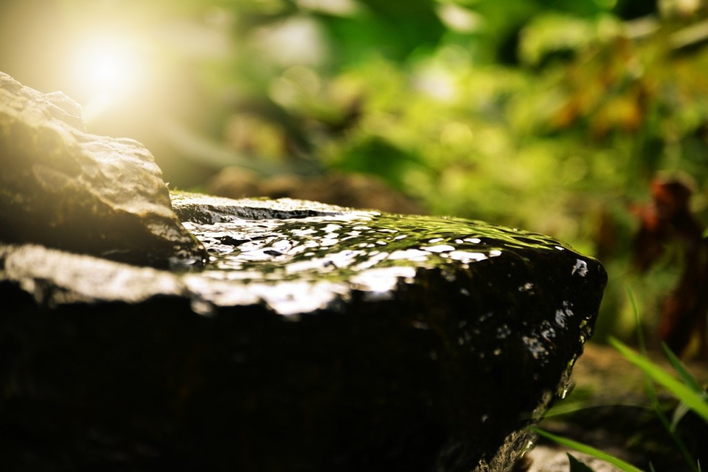 small Water fall going down a smooth rock