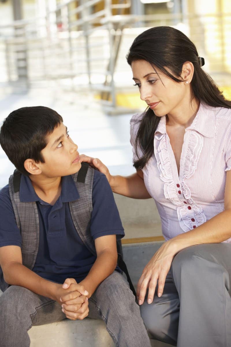 Mother sitting down with son talking about good touch/bad touch 