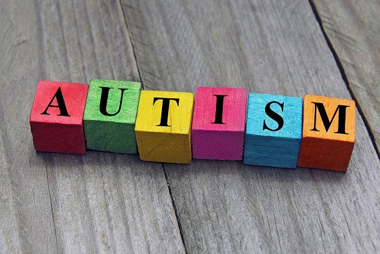 Color letter blocks with the word AUTISM