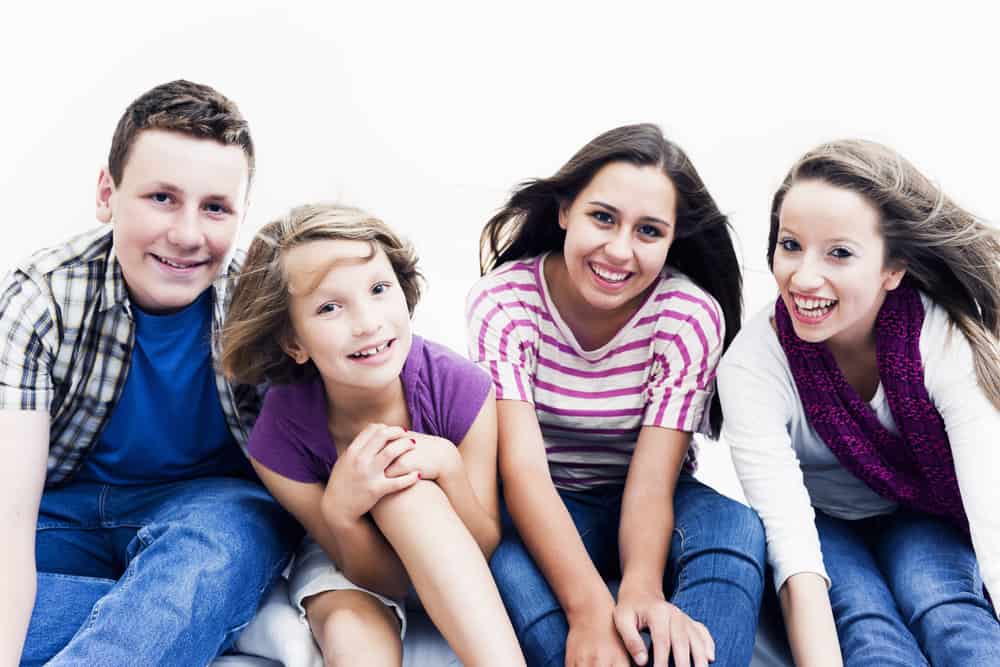 Group of 4 kids smiling