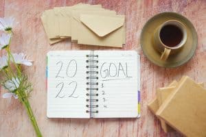 a notebook with goals on Ways to Actually Achieve Your New Year's Resolutions