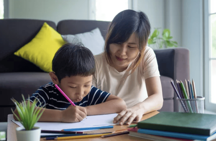 tutor helping child with homework