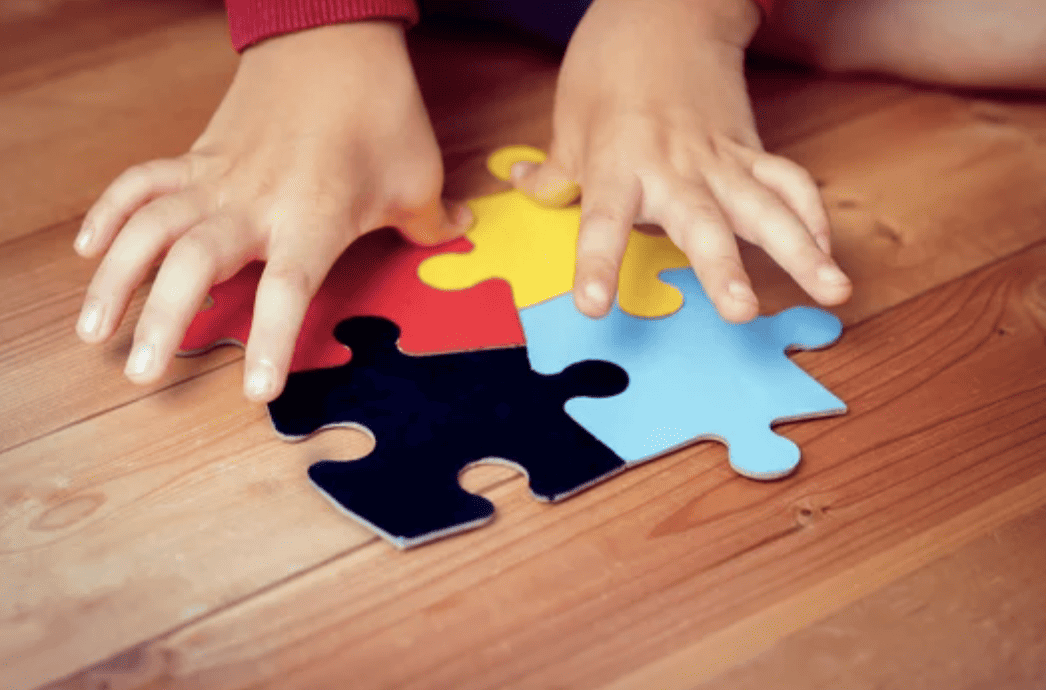 kid playing with puzzle.