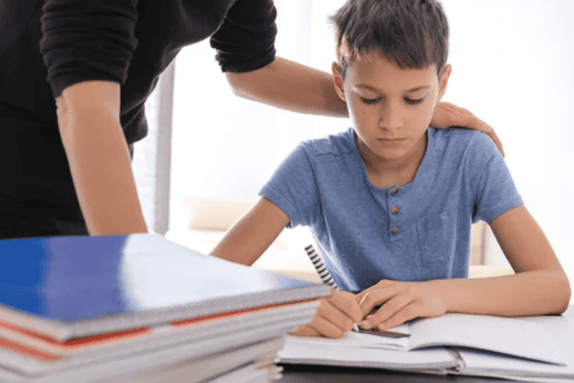 tutor helping child with homework