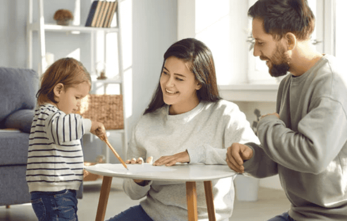 Parents helping toddler with the Supportive Plan