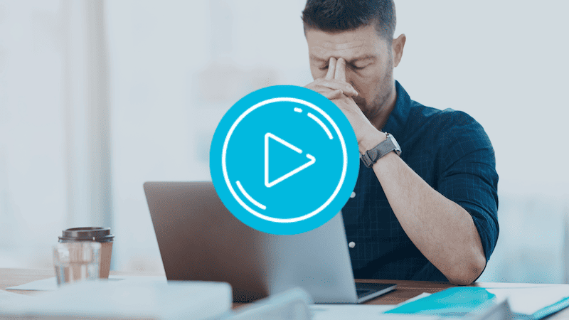 Man burnt out, working on laptop.