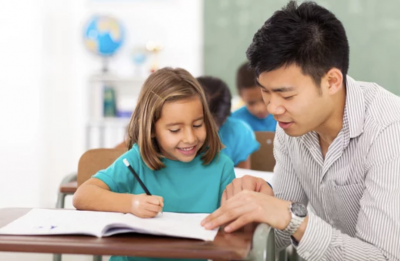 Tutor helping child with work