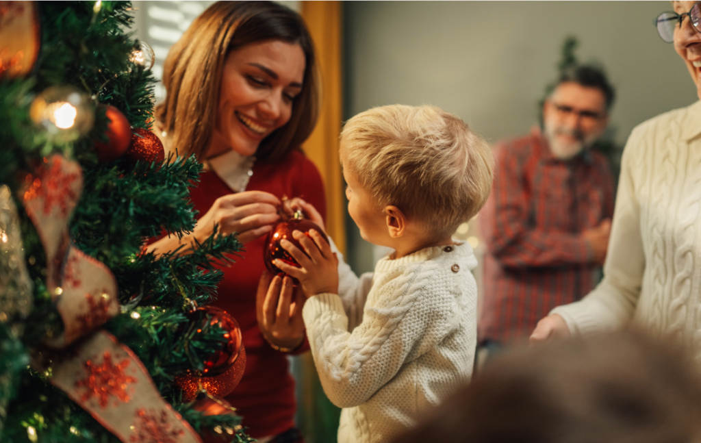 Mother and child decorating tree