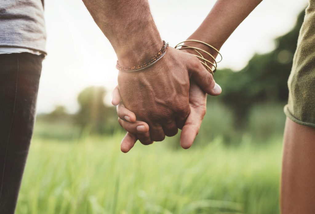 adult couple holding hands