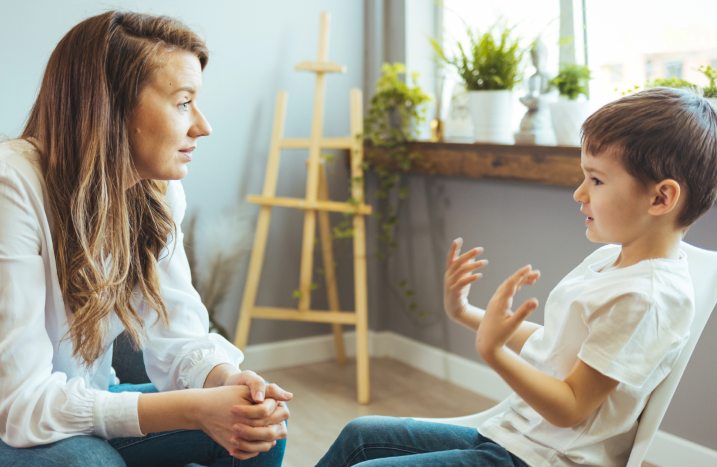 Psychologist/social worker talking to child with ADHD