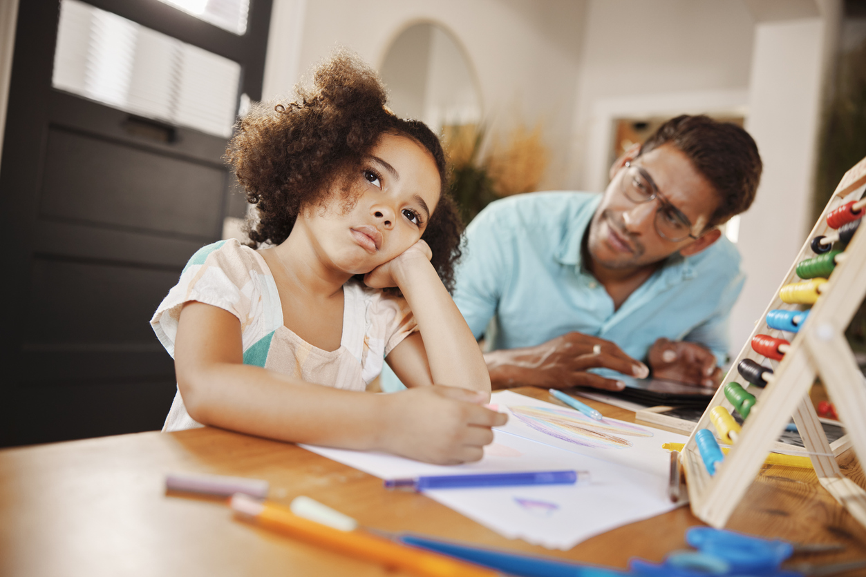 dad coaching his daughter who has adhd.