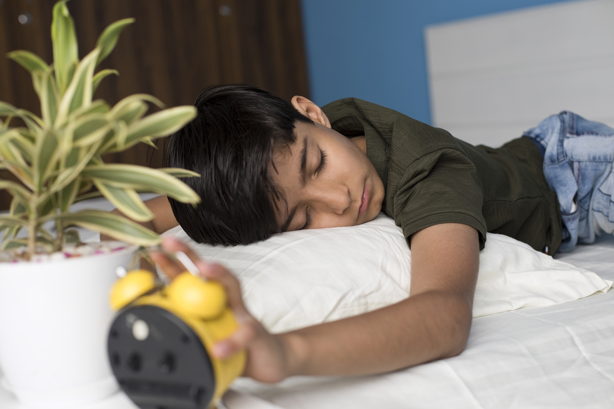 young boy resetting his sleep schedule.