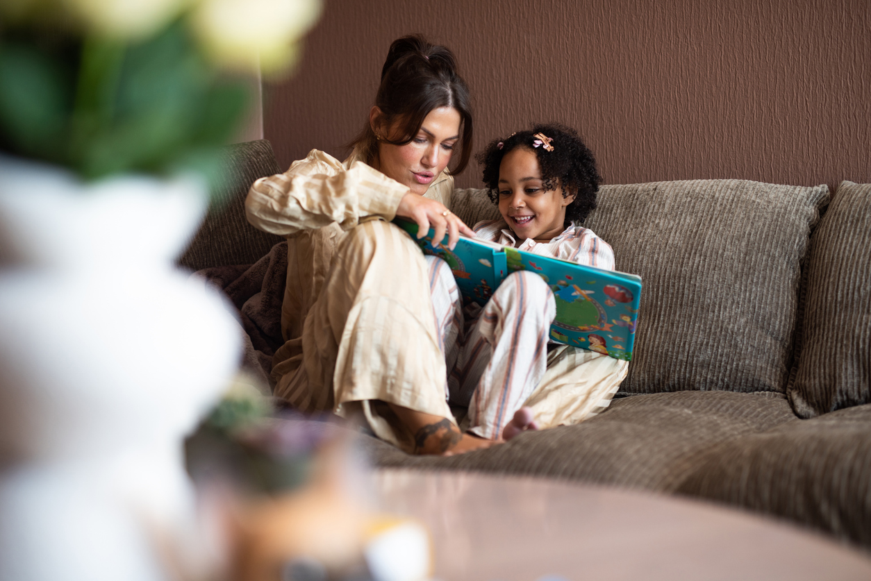 mom having a reading intervention with her daughter.